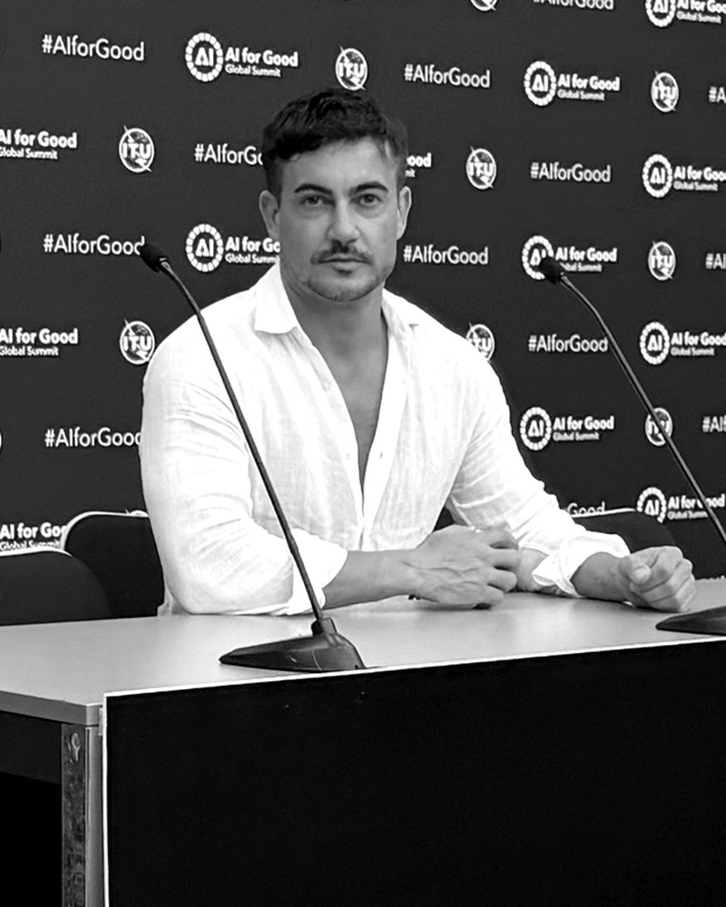 Claudiu at the AI for Good press desk in Geneva